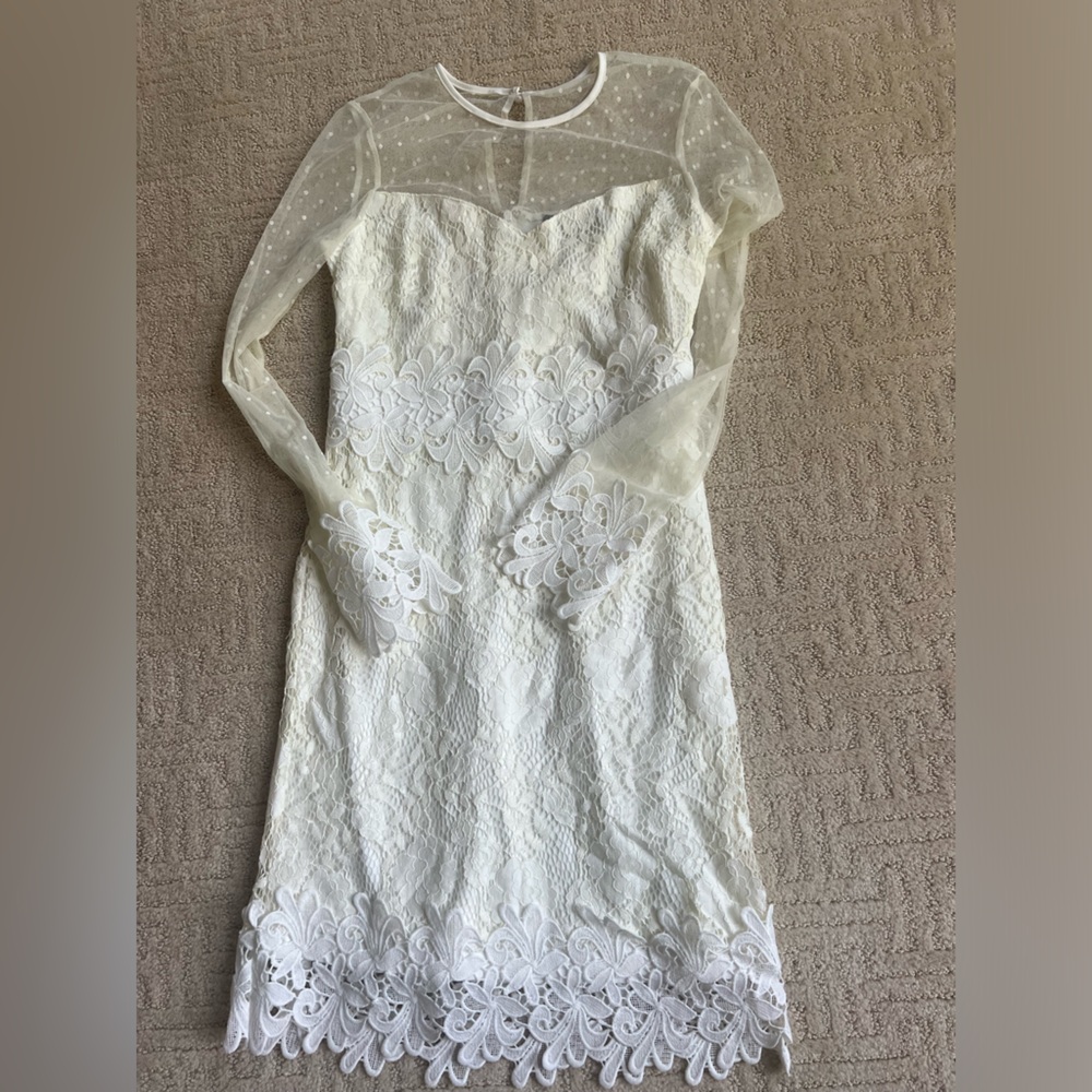 Long sleeve white dress, used for a church wedding ceremony